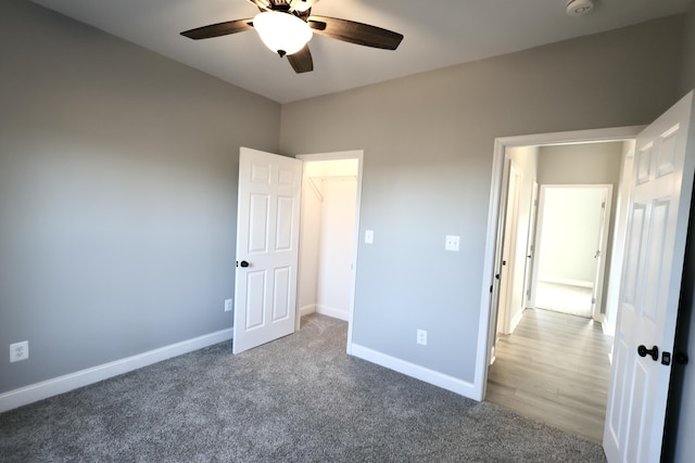 unfurnished bedroom with ceiling fan and carpet floors