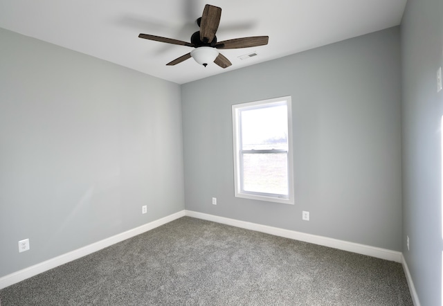 spare room with carpet flooring and ceiling fan