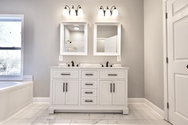 bathroom with vanity and a bathtub