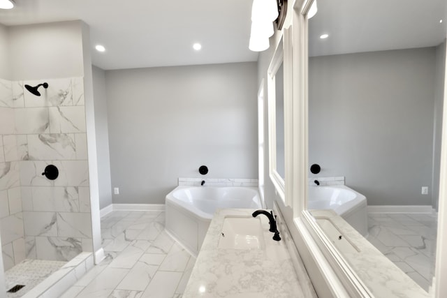 bathroom with vanity and independent shower and bath