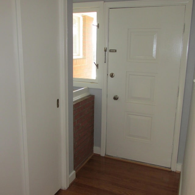 doorway to outside featuring dark hardwood / wood-style floors