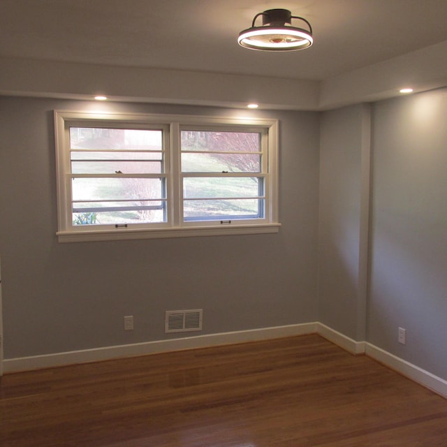 unfurnished room featuring wood-type flooring