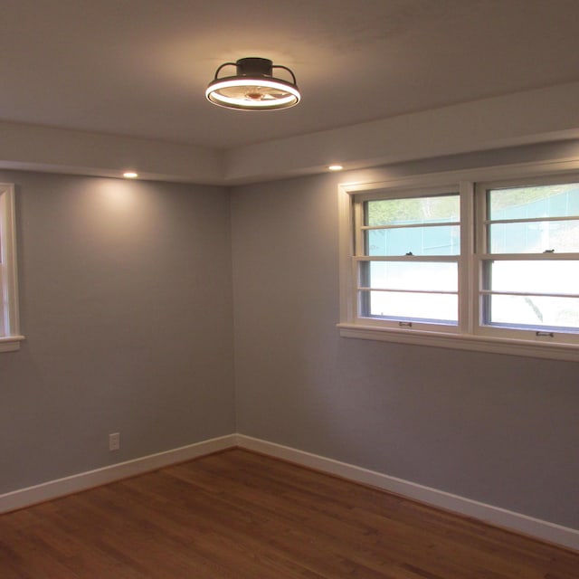 empty room with hardwood / wood-style floors