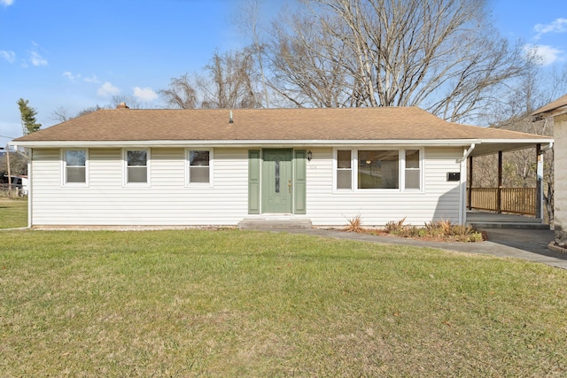 back of property featuring a lawn