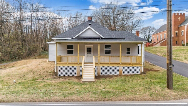 view of front of home featuring a porch and a front yard