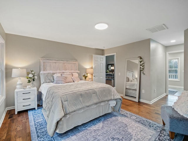 bedroom featuring dark wood-type flooring