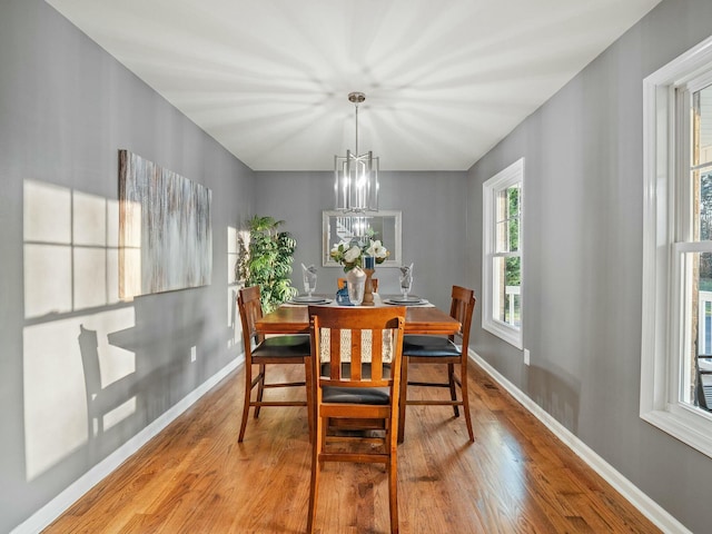 dining room featuring a chandelier and light wood-type flooring