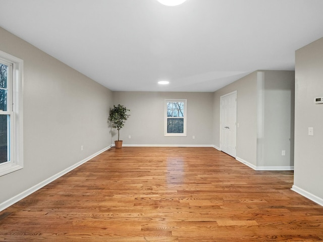 spare room featuring light hardwood / wood-style flooring