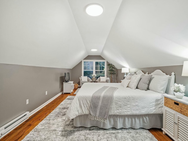 bedroom with dark hardwood / wood-style floors, a baseboard radiator, and vaulted ceiling