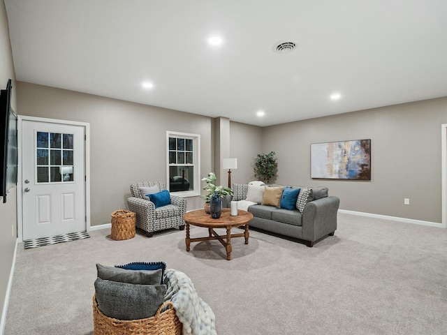 living room featuring light carpet