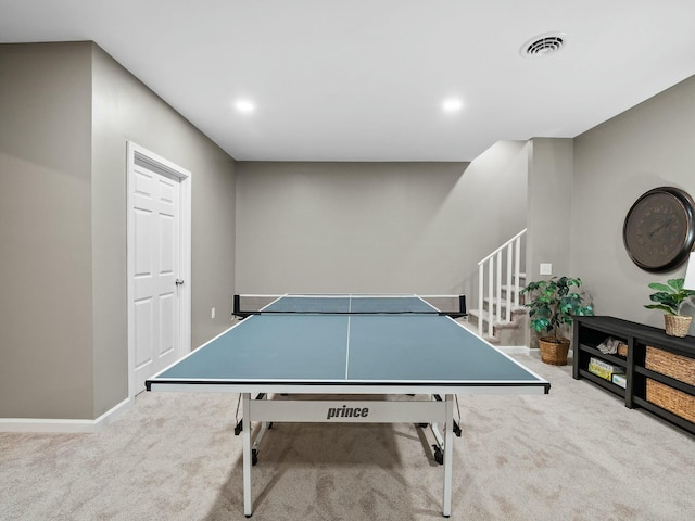 game room featuring light carpet