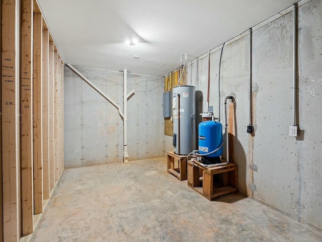 utility room featuring electric panel and water heater