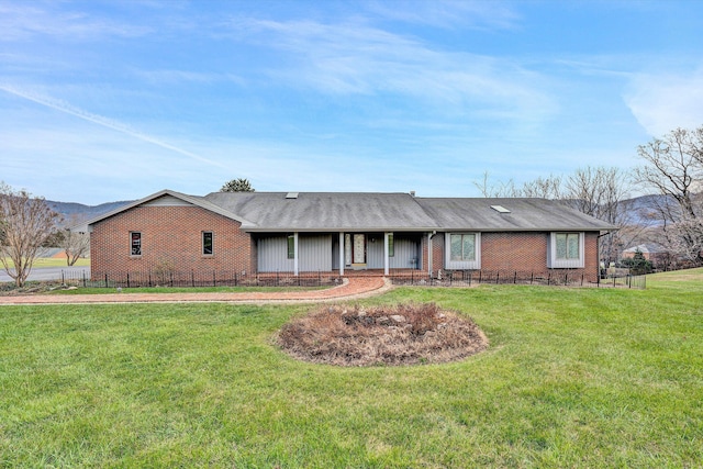 ranch-style home with a front yard