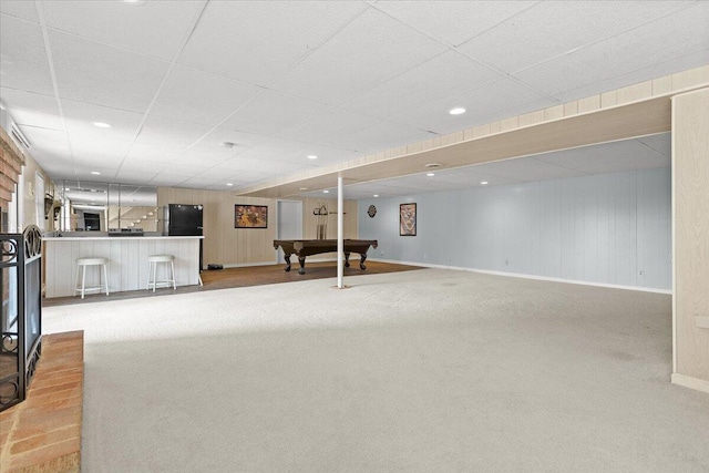 finished below grade area with a paneled ceiling, recessed lighting, billiards, a bar, and carpet