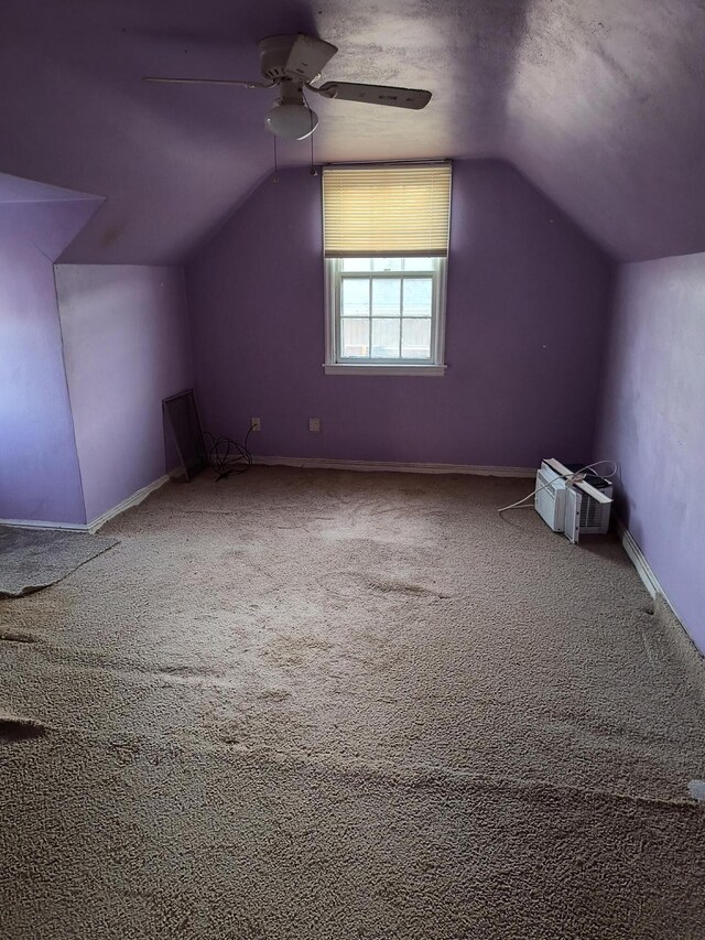 unfurnished room featuring ceiling fan, a wall mounted air conditioner, and hardwood / wood-style floors