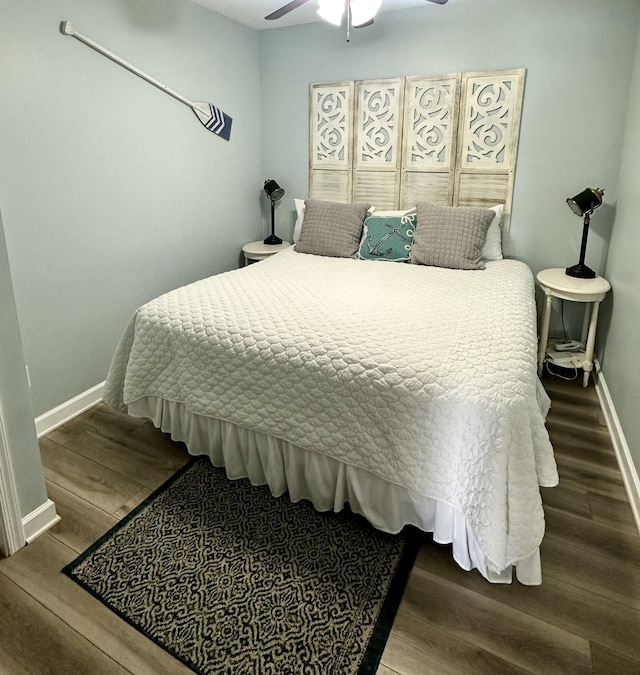 bedroom featuring hardwood / wood-style flooring and ceiling fan