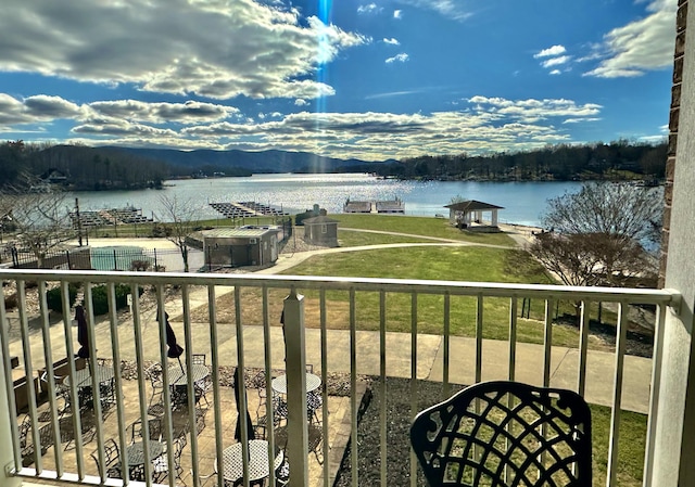 balcony featuring a water view