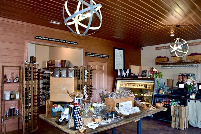 interior space featuring concrete flooring and wooden walls