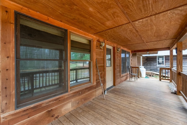 wooden terrace with a porch