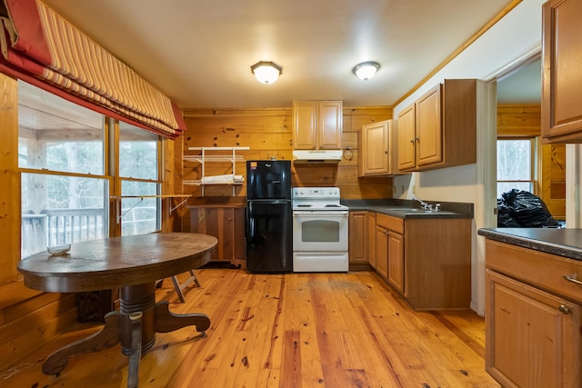 kitchen featuring under cabinet range hood, a sink, white electric range oven, freestanding refrigerator, and light wood finished floors