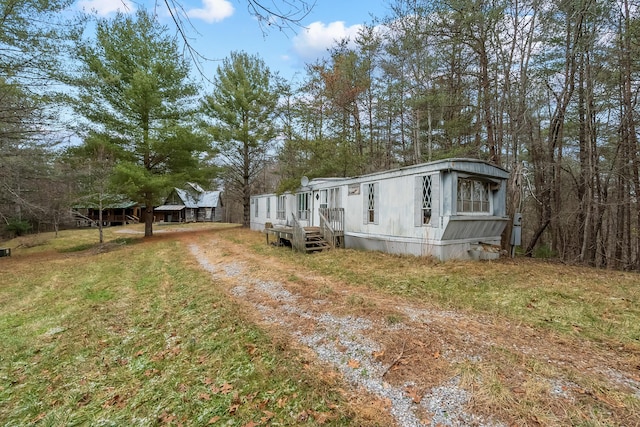 view of front of house with a front yard and driveway