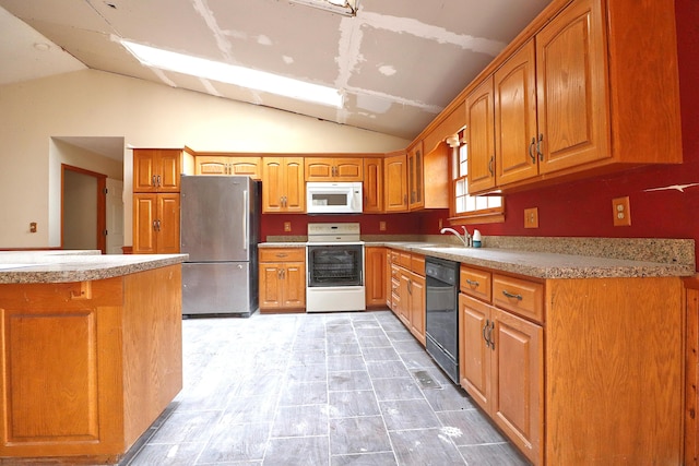 kitchen with lofted ceiling, sink, and white appliances