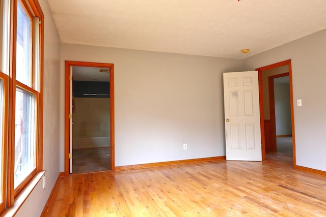 spare room with light hardwood / wood-style flooring