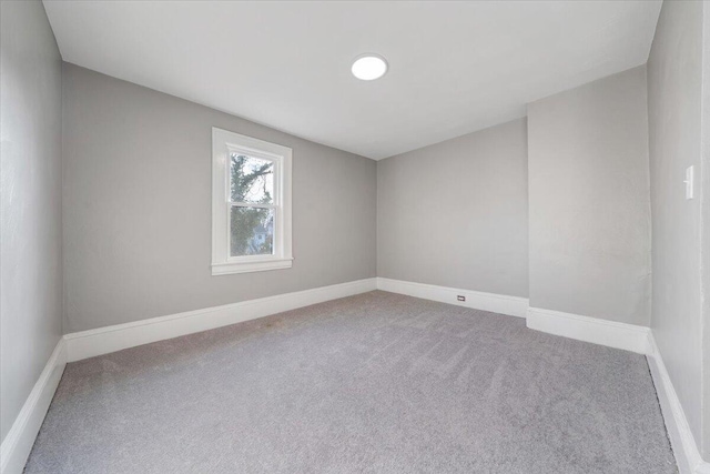 unfurnished room with carpet flooring