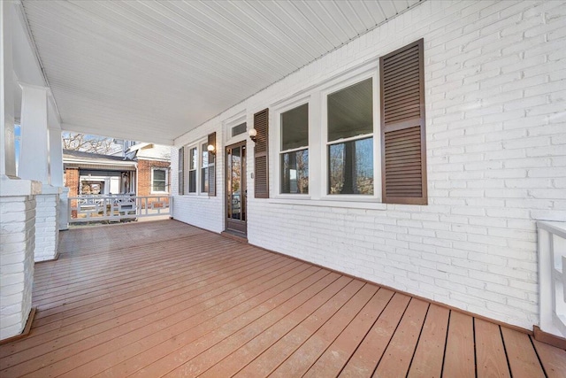 wooden deck featuring covered porch