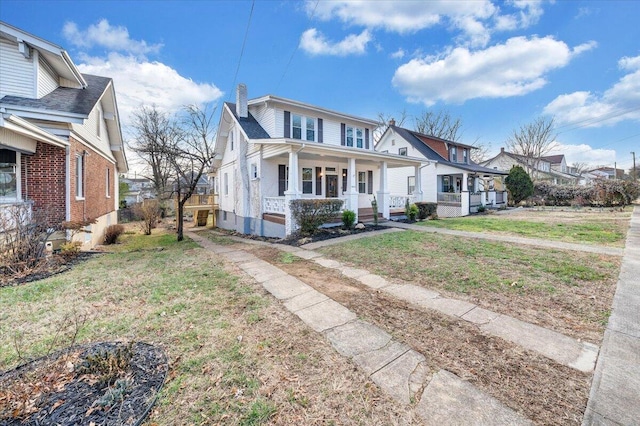 bungalow-style home featuring a front yard and a porch