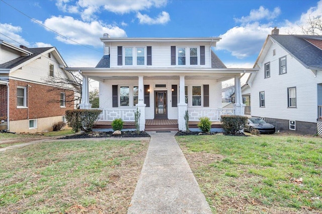 bungalow-style home featuring a porch and a front yard