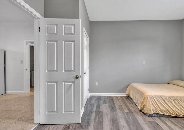 bedroom with light wood-type flooring