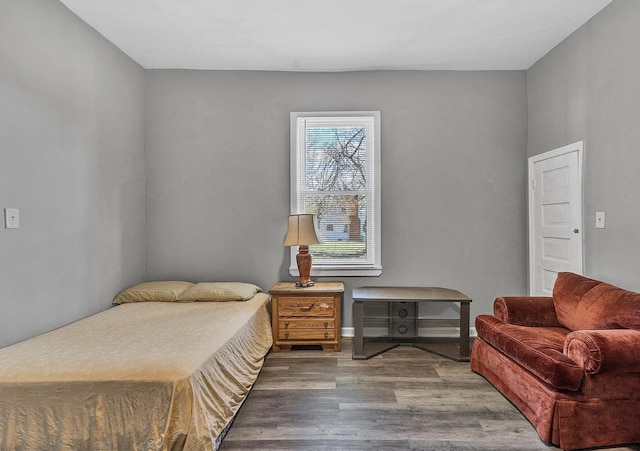 bedroom with hardwood / wood-style floors