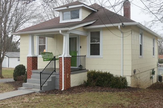 bungalow-style home with a porch