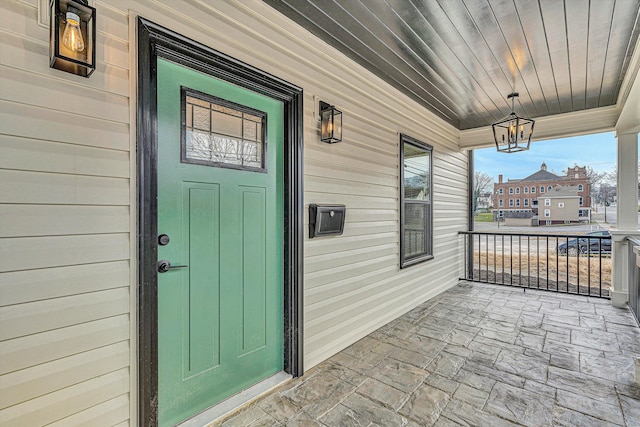 property entrance featuring covered porch