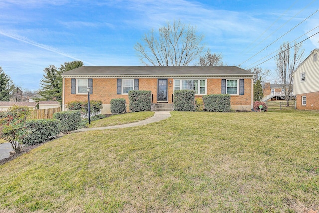 ranch-style home featuring a front yard