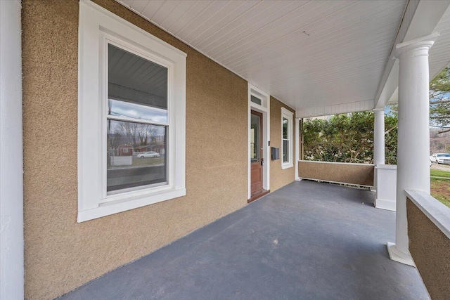 view of patio featuring a porch