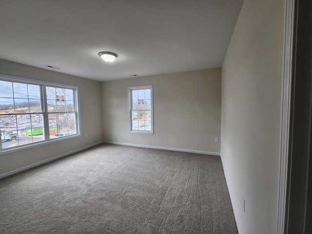 unfurnished room with carpet floors