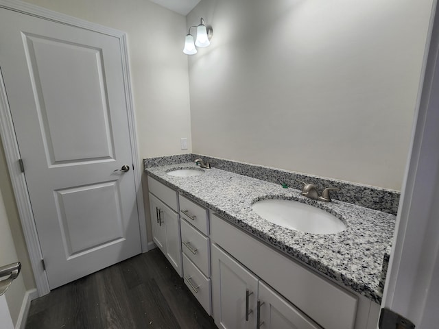 bathroom with vanity and hardwood / wood-style flooring