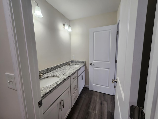 bathroom with vanity and wood-type flooring