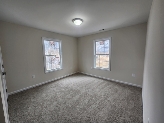 unfurnished room with carpet floors