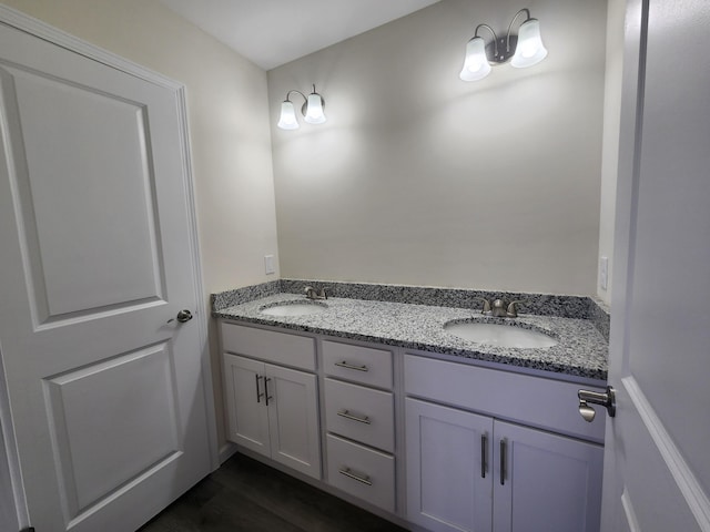 bathroom featuring vanity and hardwood / wood-style flooring