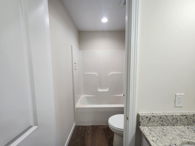 full bathroom featuring vanity, wood-type flooring, tub / shower combination, and toilet