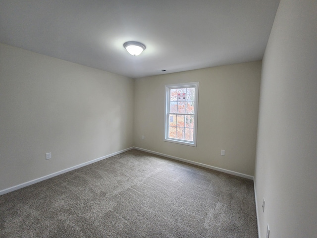 unfurnished room with carpet floors