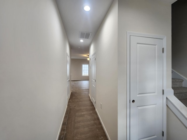 hall with dark wood-type flooring