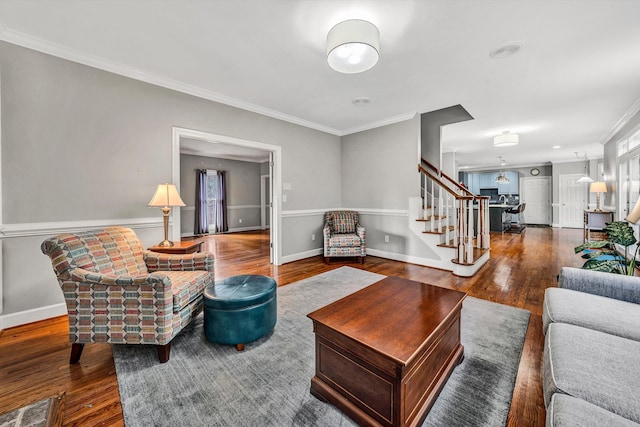 living room featuring dark hardwood / wood-style flooring and ornamental molding