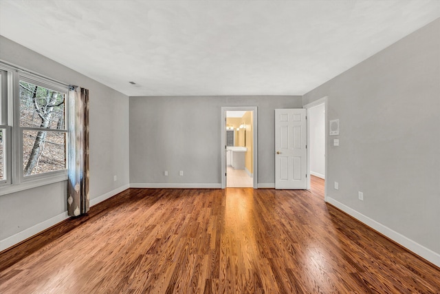 empty room featuring hardwood / wood-style flooring