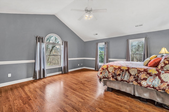 bedroom featuring hardwood / wood-style flooring, ceiling fan, and lofted ceiling