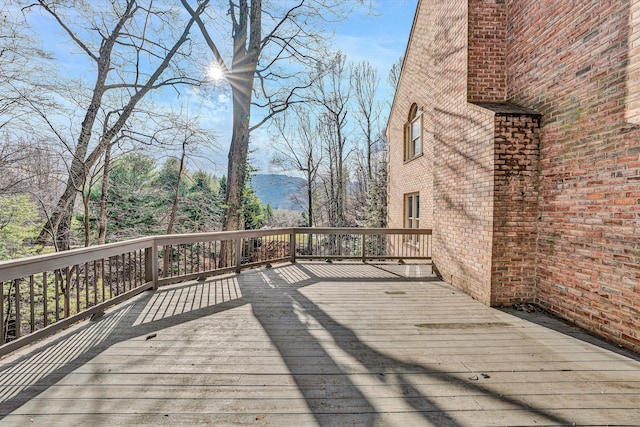 wooden deck with a mountain view