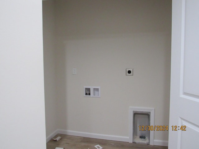 laundry room with hookup for a washing machine, baseboards, hookup for an electric dryer, and wood finished floors